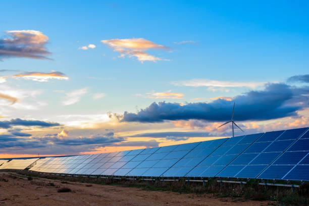 istock Photovoltaic and wind plant at sunset 1097465946