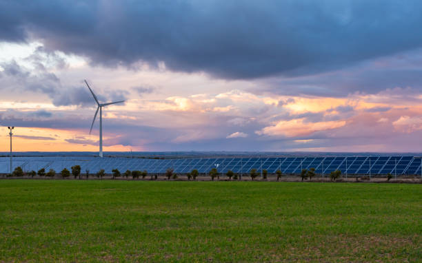 istock Photovoltaic and wind plant at sunset 1097465976
