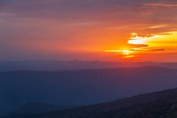 istock Fiery sunrise over the foggy mountain 1097468832