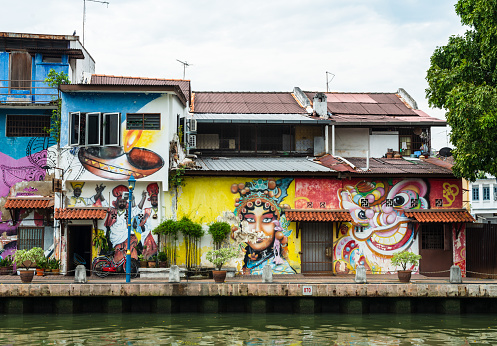 The landscape of Malacca city with colorful street art painted walls along the Malacca river (Sungai Melaka).