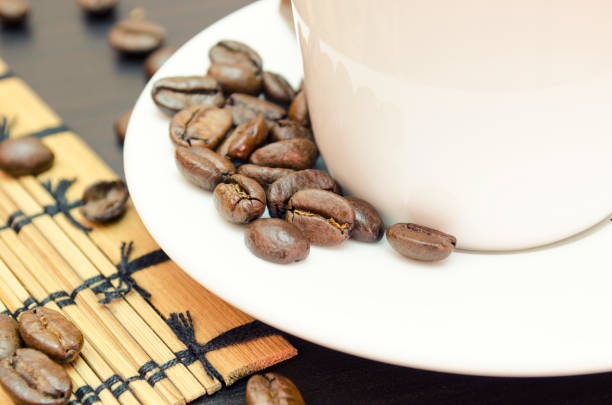 Coffee beans and white cup for him