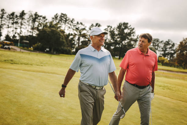 istock Senior golfers walking to the next hole 1097470698
