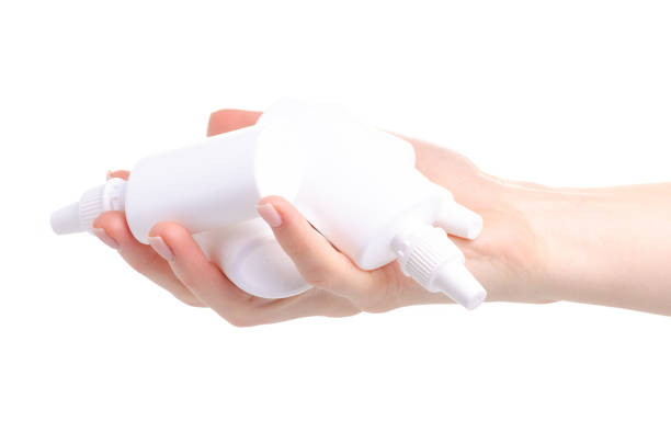 istock White bottles nose spray in hand 1097472256