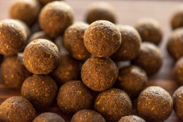 istock Carp baits on a wooden background. 1097472520
