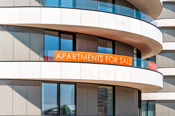 Closeup of modern skyscraper during summer in Lambeth Vauxhall building with sign on balcony for Apartments for sale Penthouse luxury London, UK - June 25, 2018: Closeup of modern skyscraper during summer in Lambeth Vauxhall building with sign on balcony for Apartments for sale Penthouse luxury bankside photos stock pictures, royalty-free photos & images