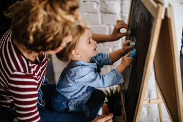istock Happy two girls painting 1097474252