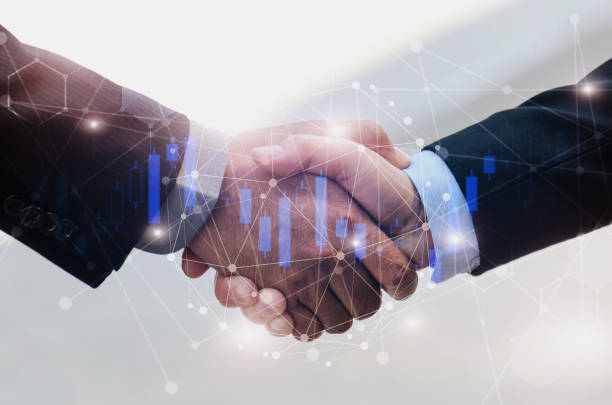 istock business man handshake with graphic network connection diagram and candle stick graph chart of stock market investment trading for Forex, teamwork, global technology, partnership, digital concept 1097474516
