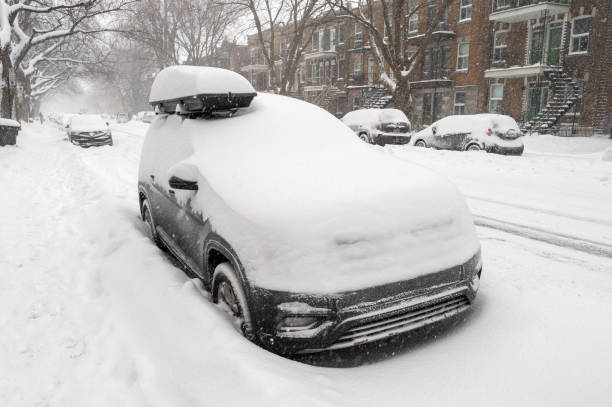 istock Cars covered with snow during snow storm. 1097475972