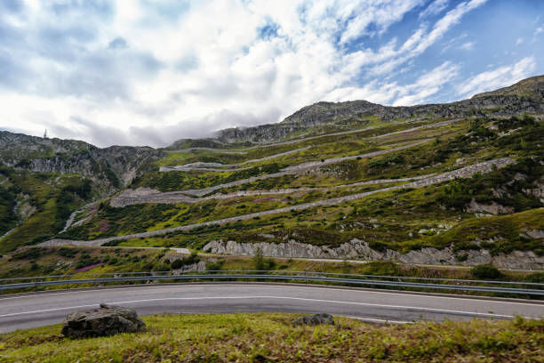Winding Grimsel pass road in Switzerland Impressive pass road in the Swiss alps. The Grimsel Pass connects the cantons of Valais, Berne and Uri. grimsel pass photos stock pictures, royalty-free photos & images