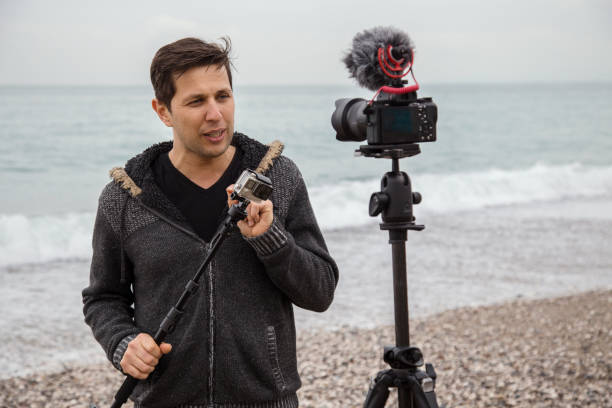 istock Vlogger making video about cameras and photography 1097480974