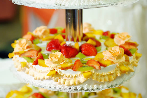 Wedding cake decorated with fresh berries.