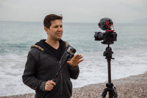 istock Vlogger making video about cameras and photography 1097484822