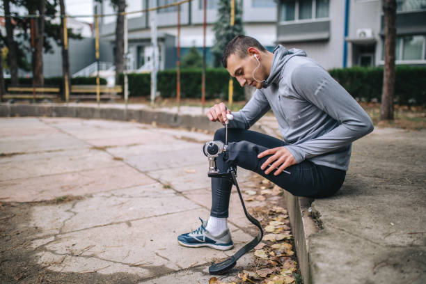 istock Amputee athlete repairing his orthopedic leg 1097485084