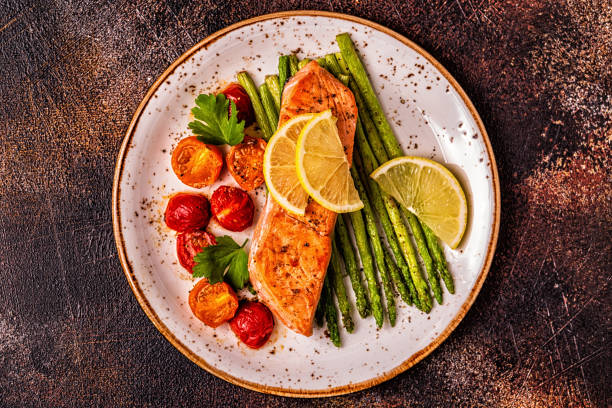istock Grilled salmon with asparagus and tomatoes 1097488092