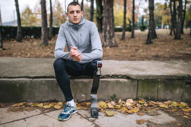 istock Contemplating amputee athlete sitting outdoors 1097488718