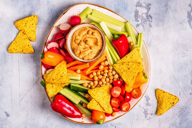 istock Hummus with various fresh raw vegetables 1097490092