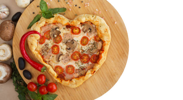 istock Pizza heart shaped on wood 1097490474