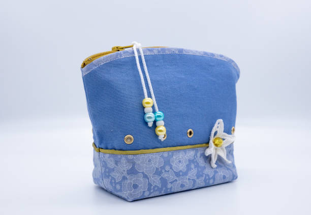 istock Elegant women's handbag for cosmetics on a white background. Handmade. 1097490520