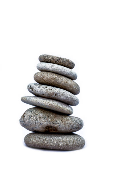 istock A bunch of pebbles or small stones on each other isolated on white. 1097492824