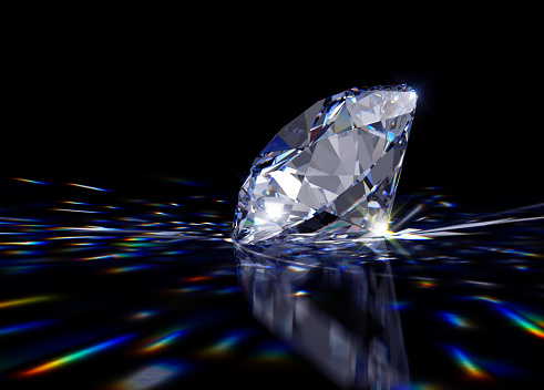 side view of a round cut diamond on black background