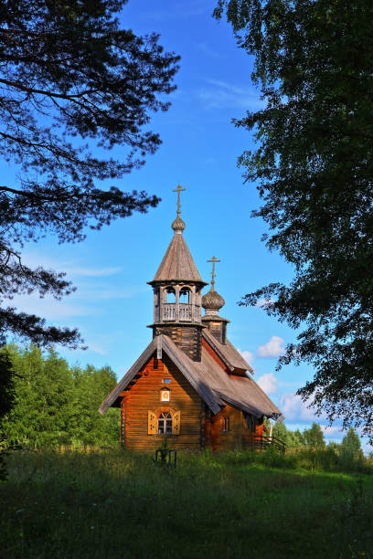 istock Wooden Church in a forest clearing 1097498330