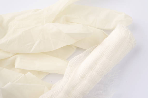 istock Medical glove and bandage on a white background. 1097498998