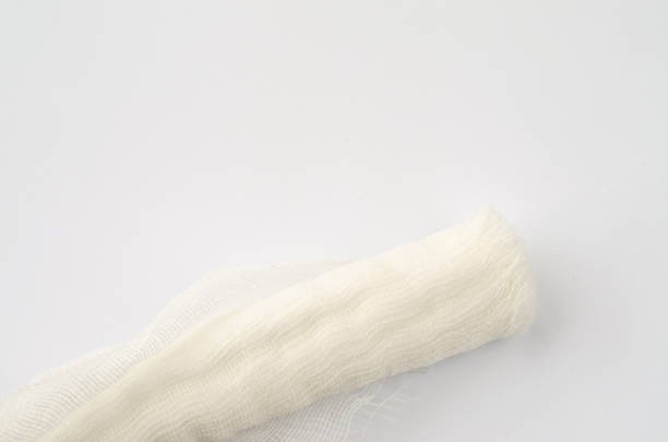 istock Medical glove and bandage on a white background. 1097499040