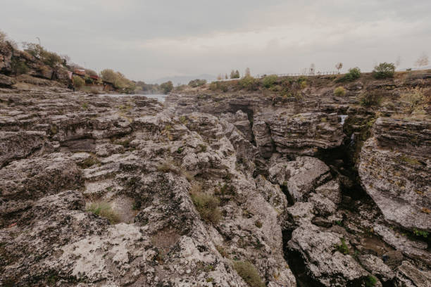 istock Mountain river with huge, big, and small stones and rocks on riverbed 1097499314