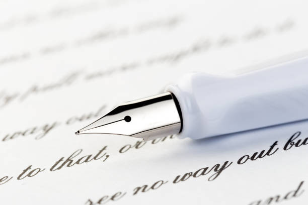 istock white fountain pen on letter 1097501036