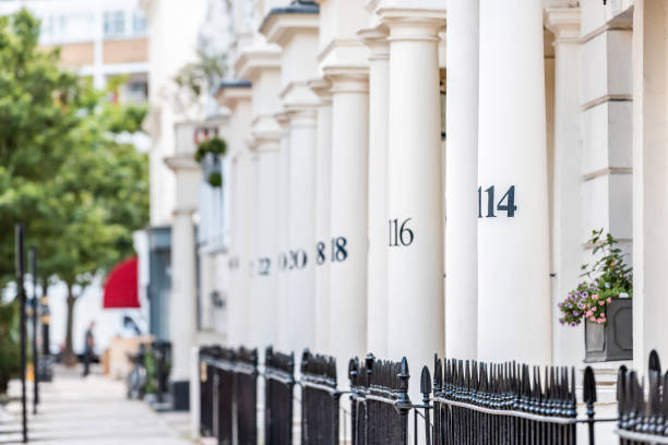 London neighborhood district of Pimlico with terraced housing balconies buildings and numbers on columns in old vintage historic traditional style flats London neighborhood district of Pimlico with terraced housing balconies buildings and numbers on columns in old vintage historic traditional style flats georgian style photos stock pictures, royalty-free photos & images