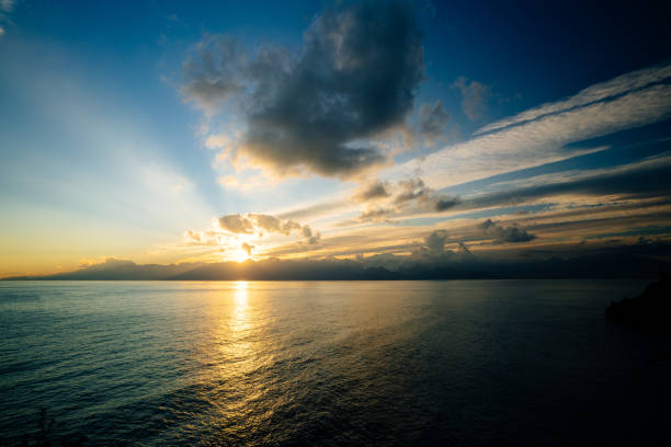 istock High mountains and sea over cloudy sunset sky 1097505820