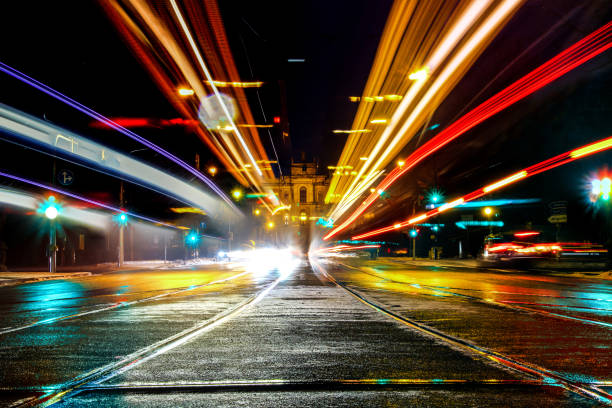 A long exposure shot of the maximilianstreet in munich, germany, with the lights of the cars and trams and the parliament of bavaria in the back A long exposure shot of the maximilianstreet in munich, germany, with the lights of the cars and trams and the parliament of bavaria in the back bavarian state parliament stock pictures, royalty-free photos & images