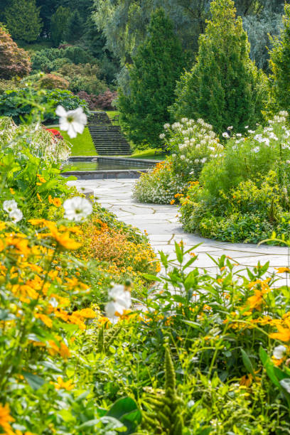 istock Park with flowerbeds and pond 1097512274
