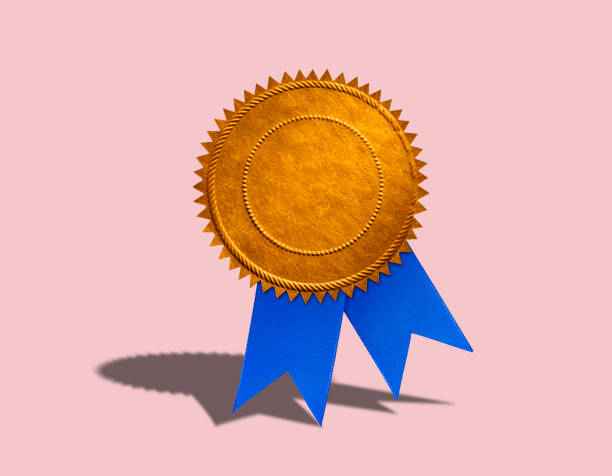 istock Blue Ribbon And Gold Seal On Pink Background 1097517728