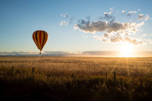 istock Sunset Hot Air Ballons Over the Prairie Canola Fields, Alberta, Canada 1097520206