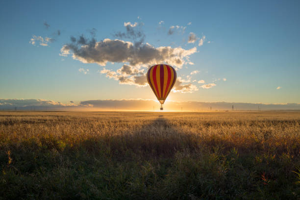 istock Sunset Hot Air Ballons Over the Prairie Canola Fields, Alberta, Canada 1097520214