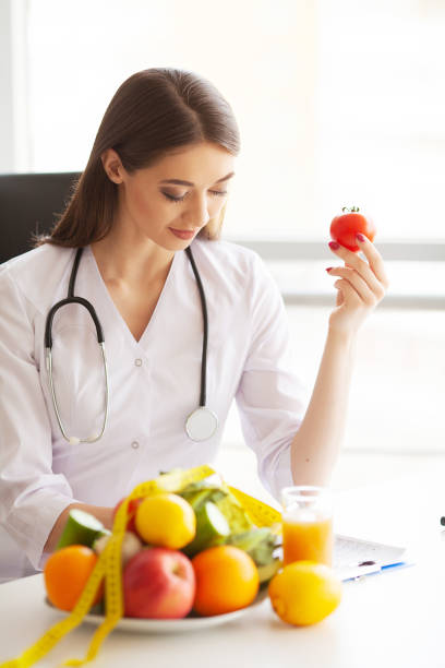istock Diet and Healthy concept. Smiling nutritionist in her office 1097529192