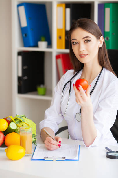 istock Diet and Healthy concept. Smiling nutritionist in her office 1097529406