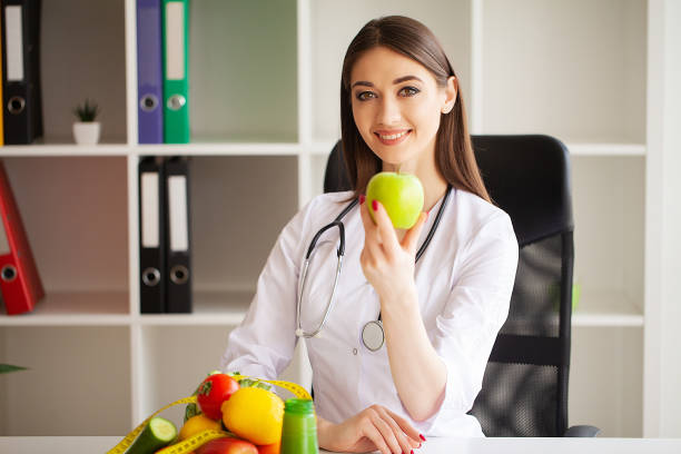 istock Diet and Healthy concept. Smiling nutritionist in her office 1097535730