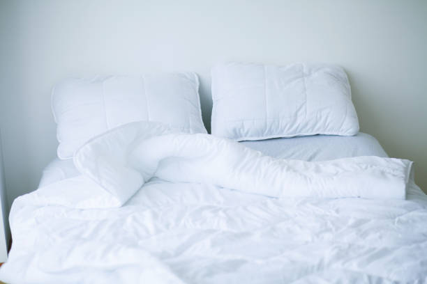 istock Good morning. Bed and pillows in white flat 1097540258