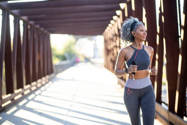 istock A Black Woman Running on a bridge 1097542528