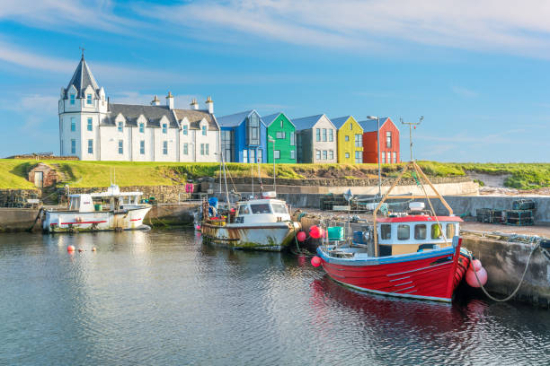 The colorful buildings of John O'Groats in a sunny afternoon, Caithness county, Scotland. stock photo
