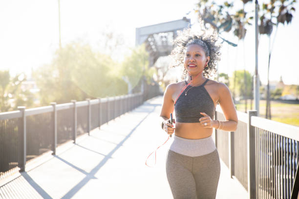 istock A Black Woman Running on a bridge 1097542864