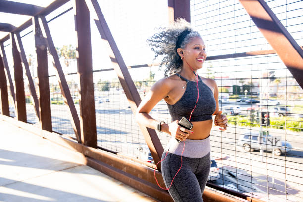 istock A Black Woman Running on a bridge 1097542970