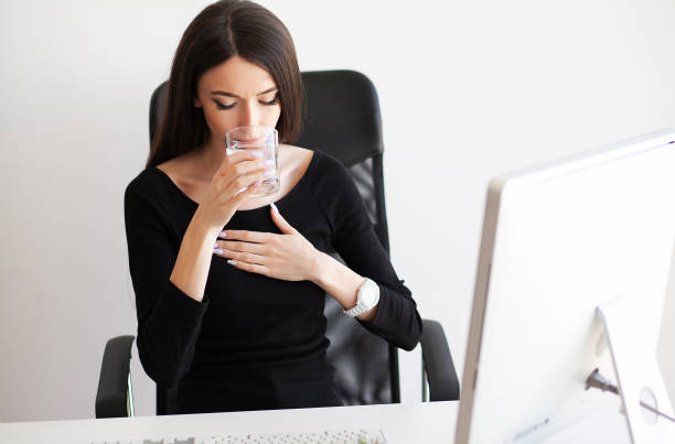 istock Heart pain. Woman having panic attack at workplace 1097543810