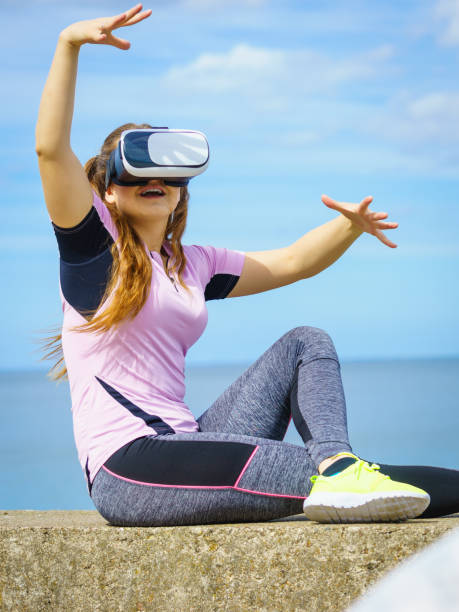 istock Woman wearing VR outside 1097543820