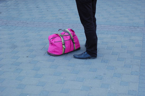 istock A traveling suitcase is taken along the path. 1097549592