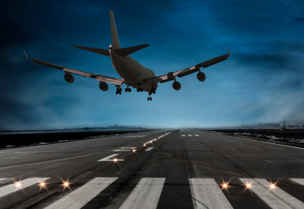 Passenger airplane landing at dusk