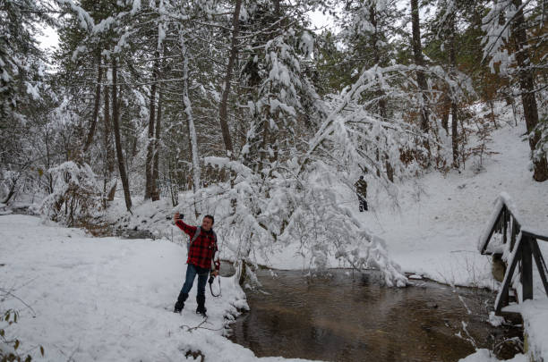 istock Winter landscape and a man is doing selfie 1097556762
