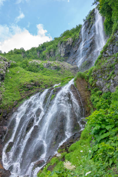 istock High waterfall falls from the green mountain 1097556986